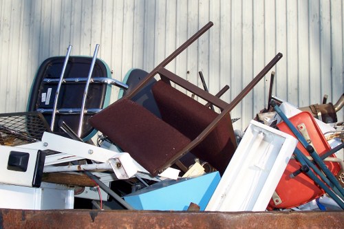 West London house clearance team sorting valuable items